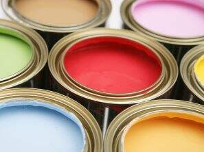 Open cans of colorful paint