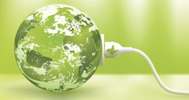 Green Earth plugged into an electrical outlet symbolizing renewable energy
